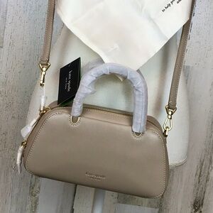 #69
Kate Spade Beige Leather Handbag
Timeless taupe color